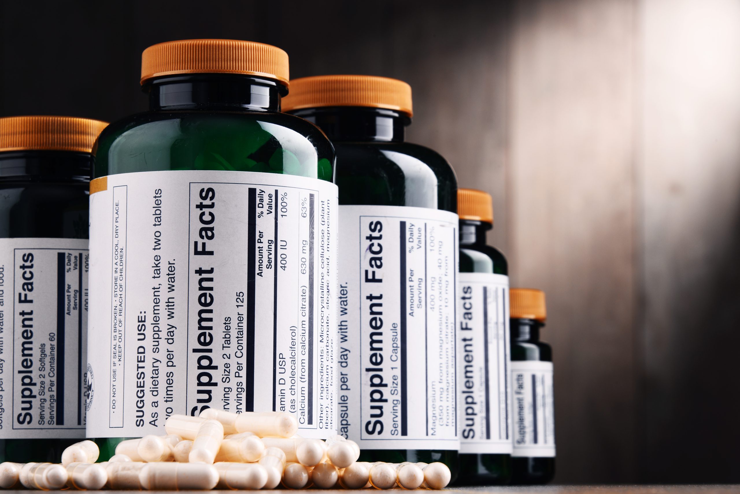 Composition with dietary supplement containers. Drug pills